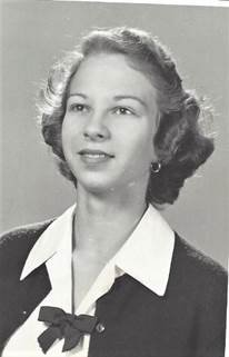 A person in a black and white photo
Description automatically generated